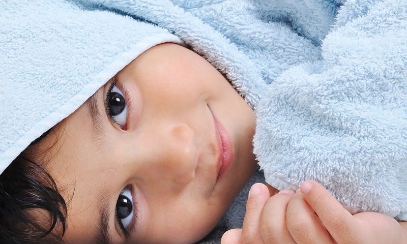 AC Systems Jacksonville Heating - Child in Blanket Staying Warm