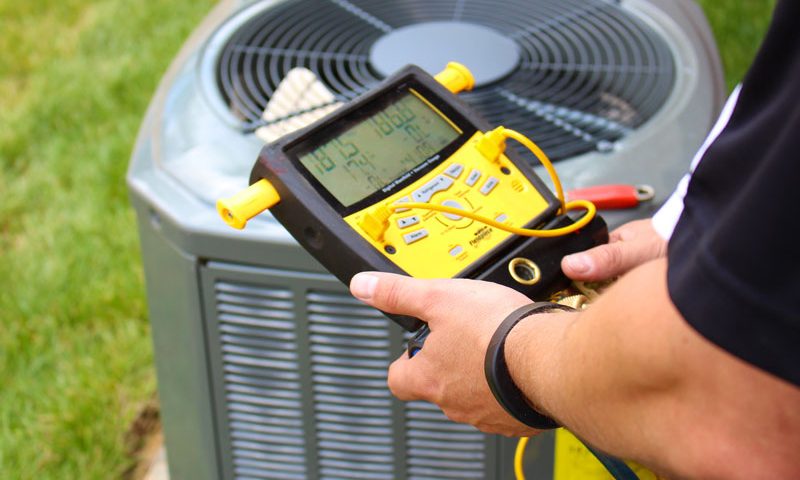 Air Conditioning Repair Jacksonville Florida - Man Working on Air Conditioning Unit