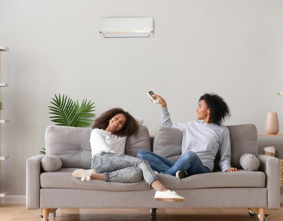 People enjoying air conditioning on hot day